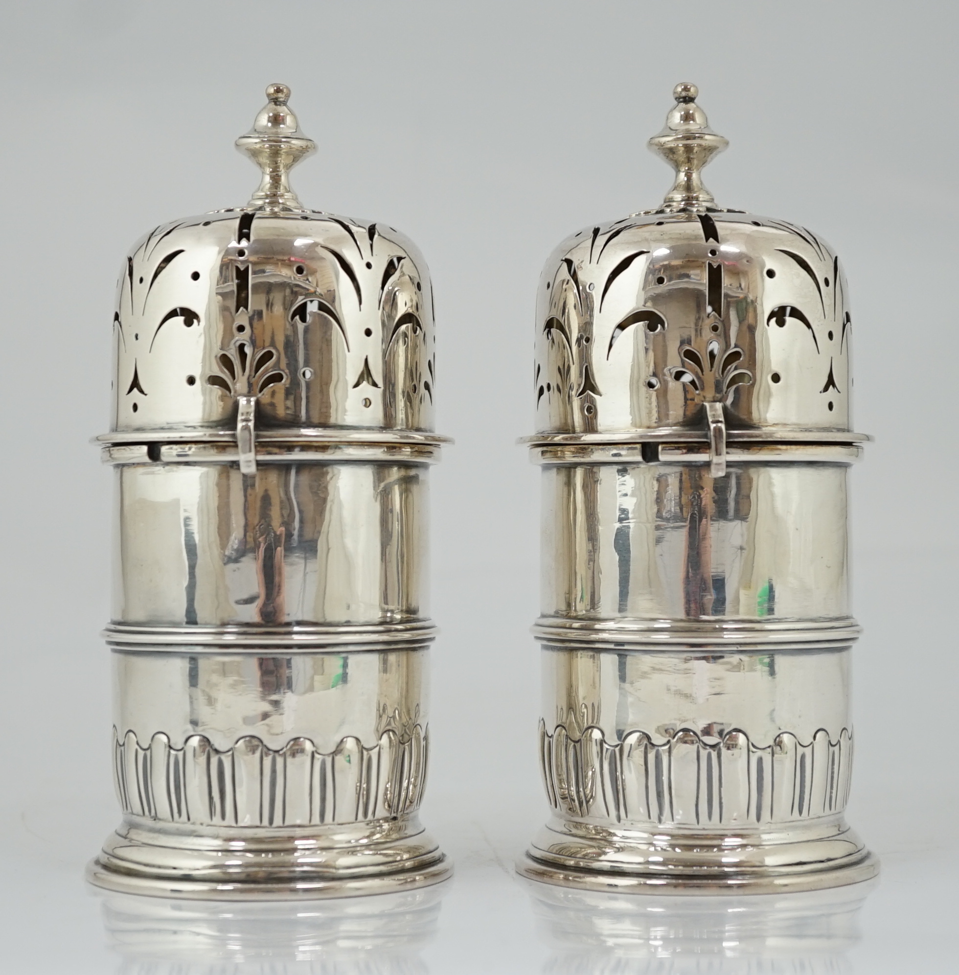 A good pair of late George I silver lighthouse casters, by William Spackman
